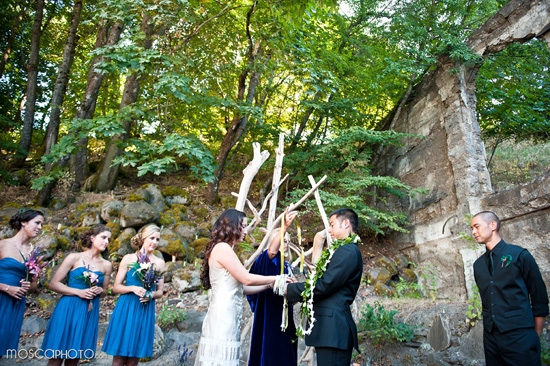 Outdoor wedding ceremony with bridesmaids in blue dresses