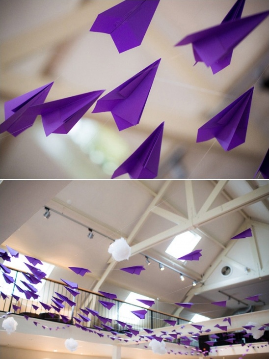Purple paper airplanes decorate a room for a party or event