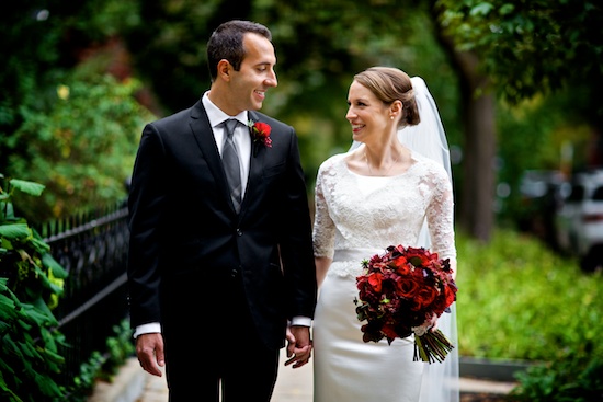 Happy newlyweds gaze at each other on their wedding day