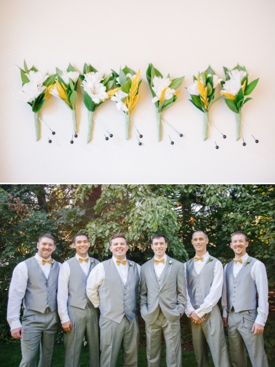 Groomsmen in gray suits with boutonnieres wedding party