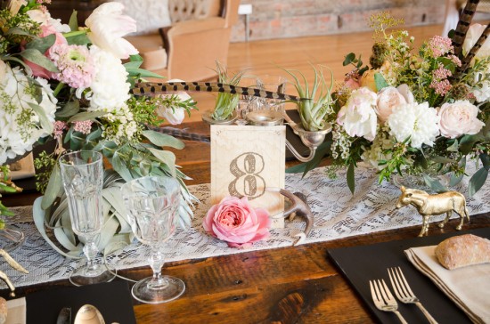 Elegant wedding table setting with flowers and table number