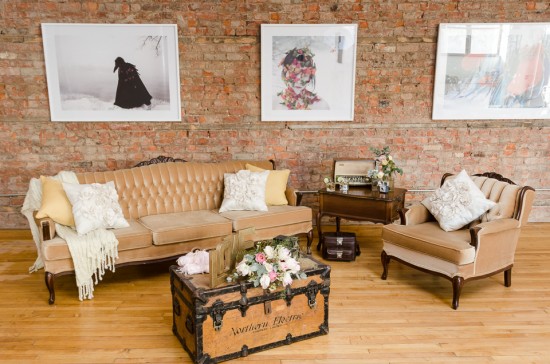 Vintage living room with tan furniture and artwork