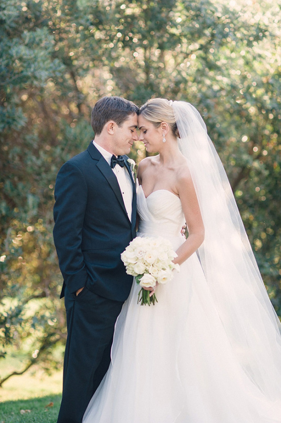 Elegant wedding couple gazing at each other lovingly