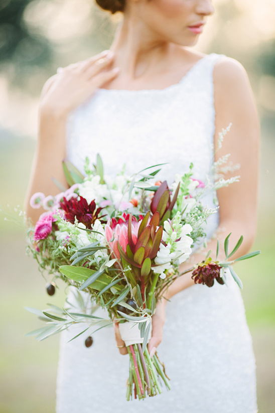 Beautiful bride with a romantic floral wedding bouquet