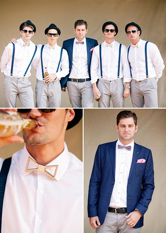 Groomsmen in bowties suspenders and hats style at wedding