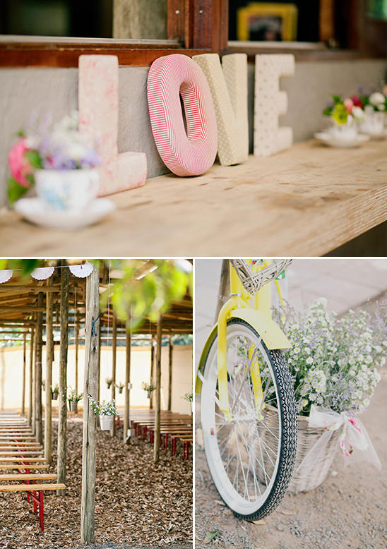 Rustic wedding decor with love sign and flower adorned bicycle