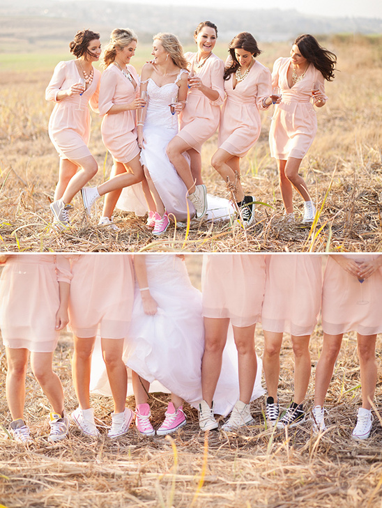 Bride and bridesmaids wearing colorful sneakers outdoors