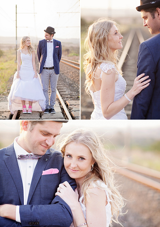 Elegant couple on a railway track during a sunset wedding photoshoot