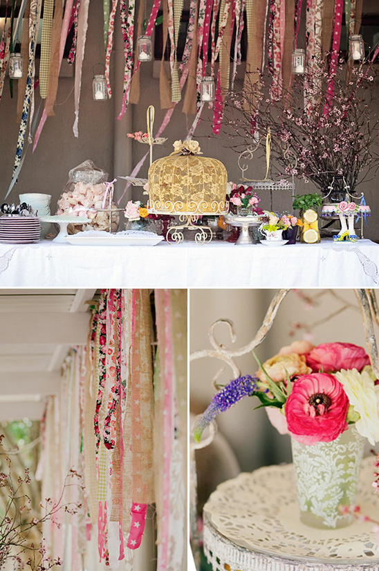 Bohemian dessert table with floral decorations and hanging ribbons