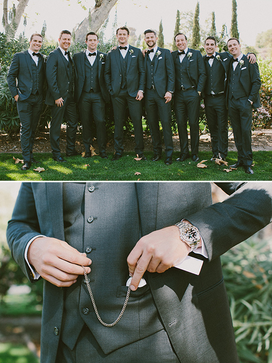 Groomsmen in suits and groom with pocket watch detail