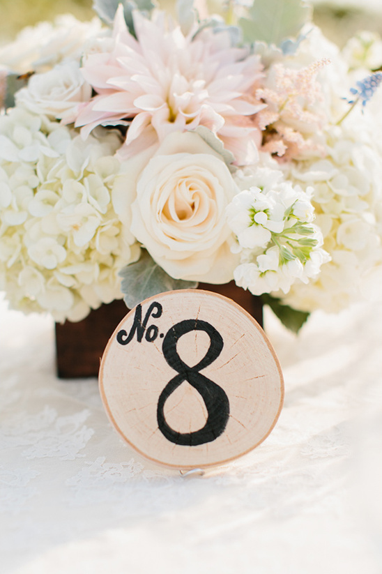 Wedding table number eight wood slice floral centerpiece