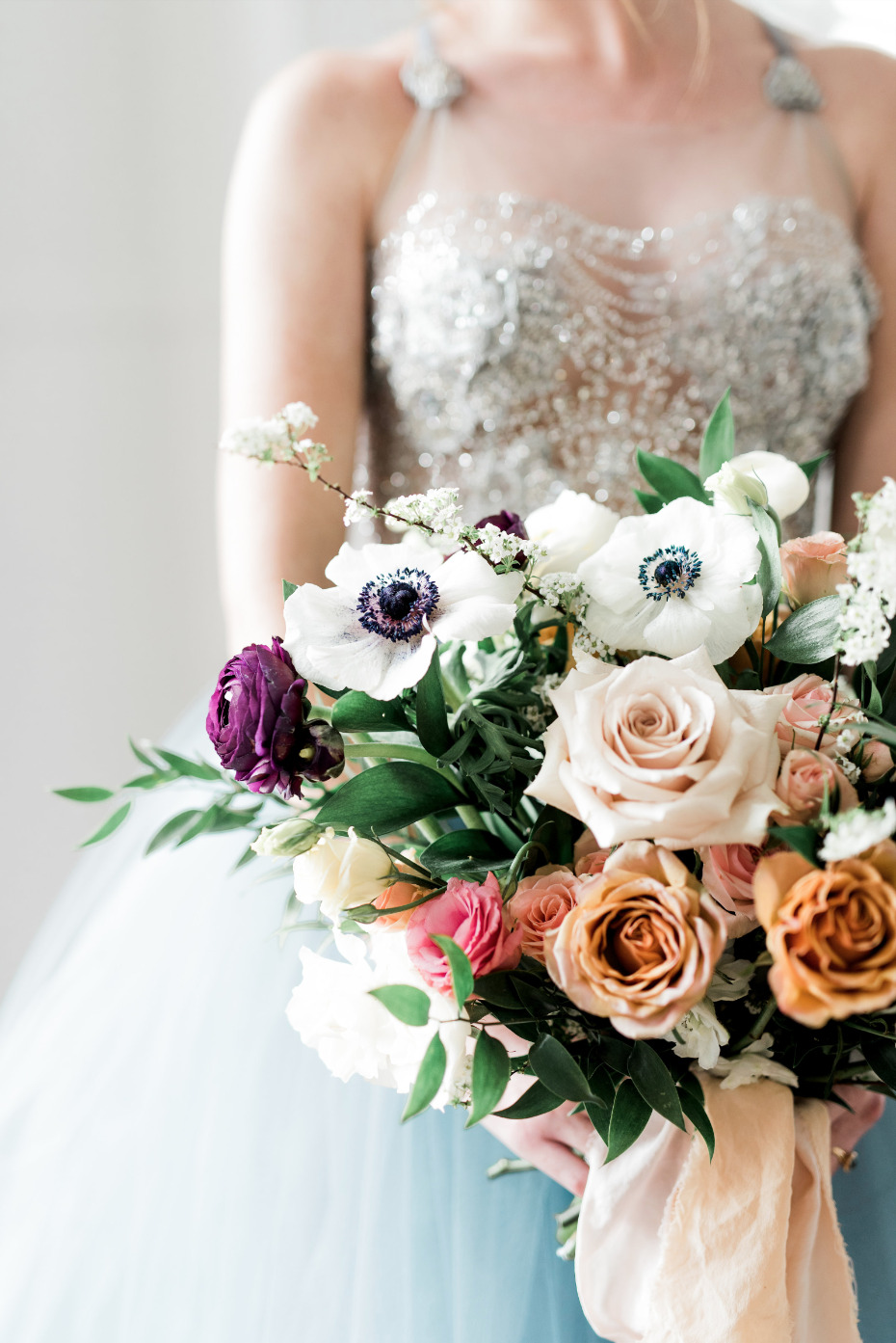 anomone wedding bouquet mixed in with roses