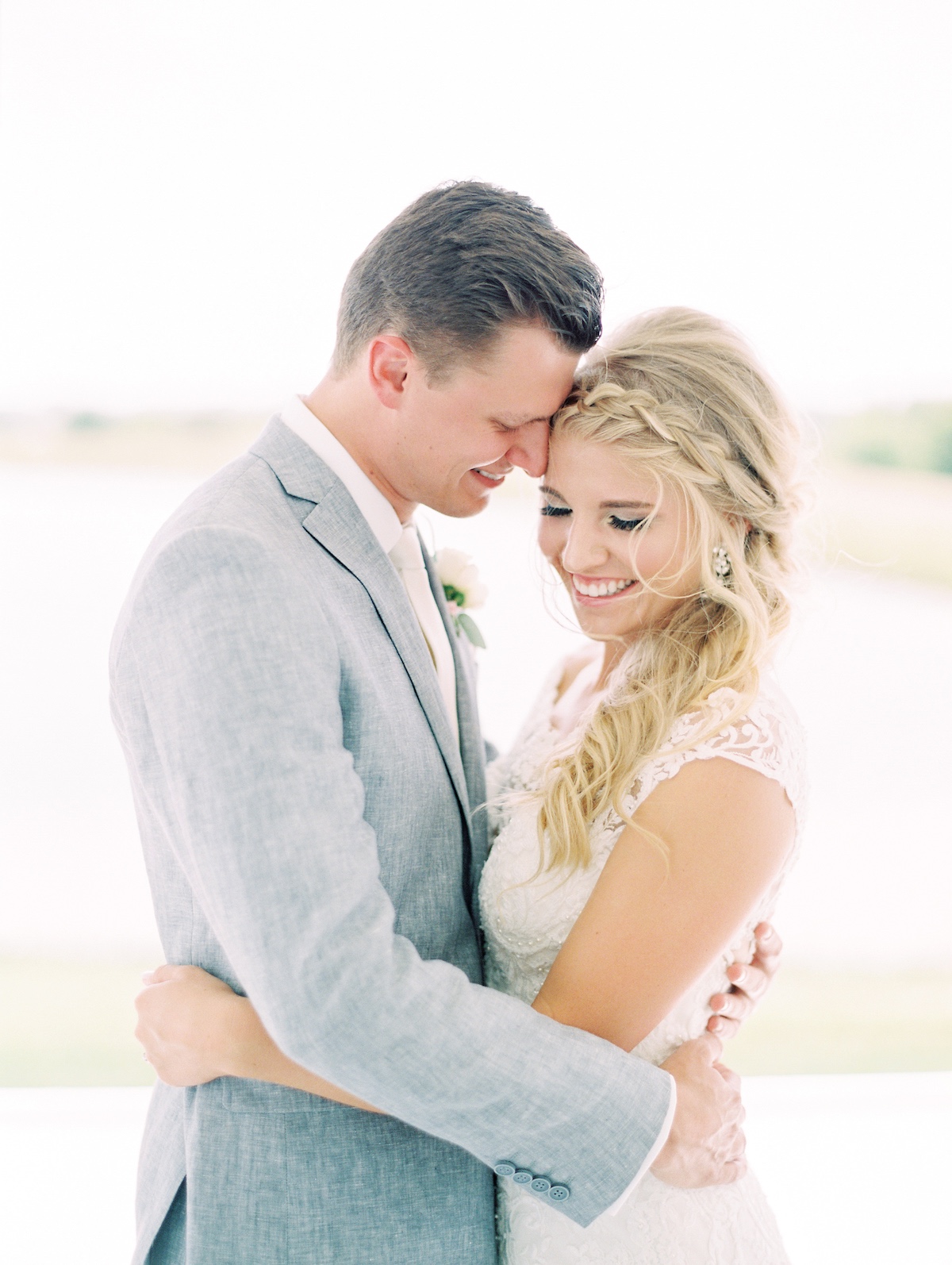 Happy bride and groom embracing lovingly on their wedding day