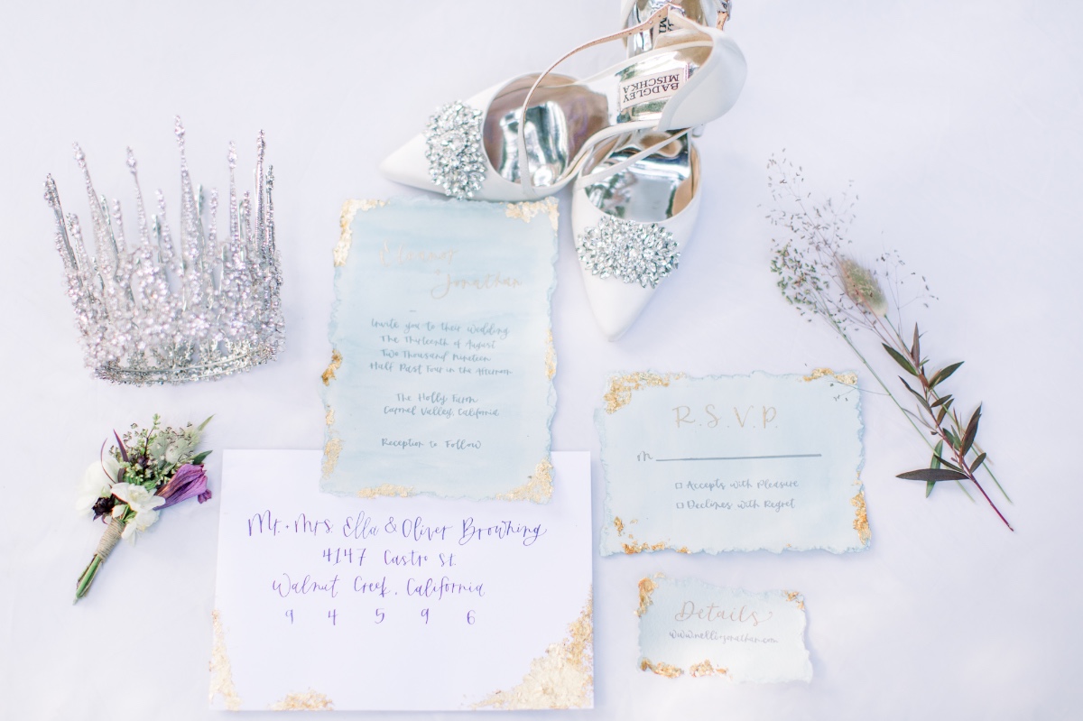 Wedding crown shoes and stationery flat lay picture