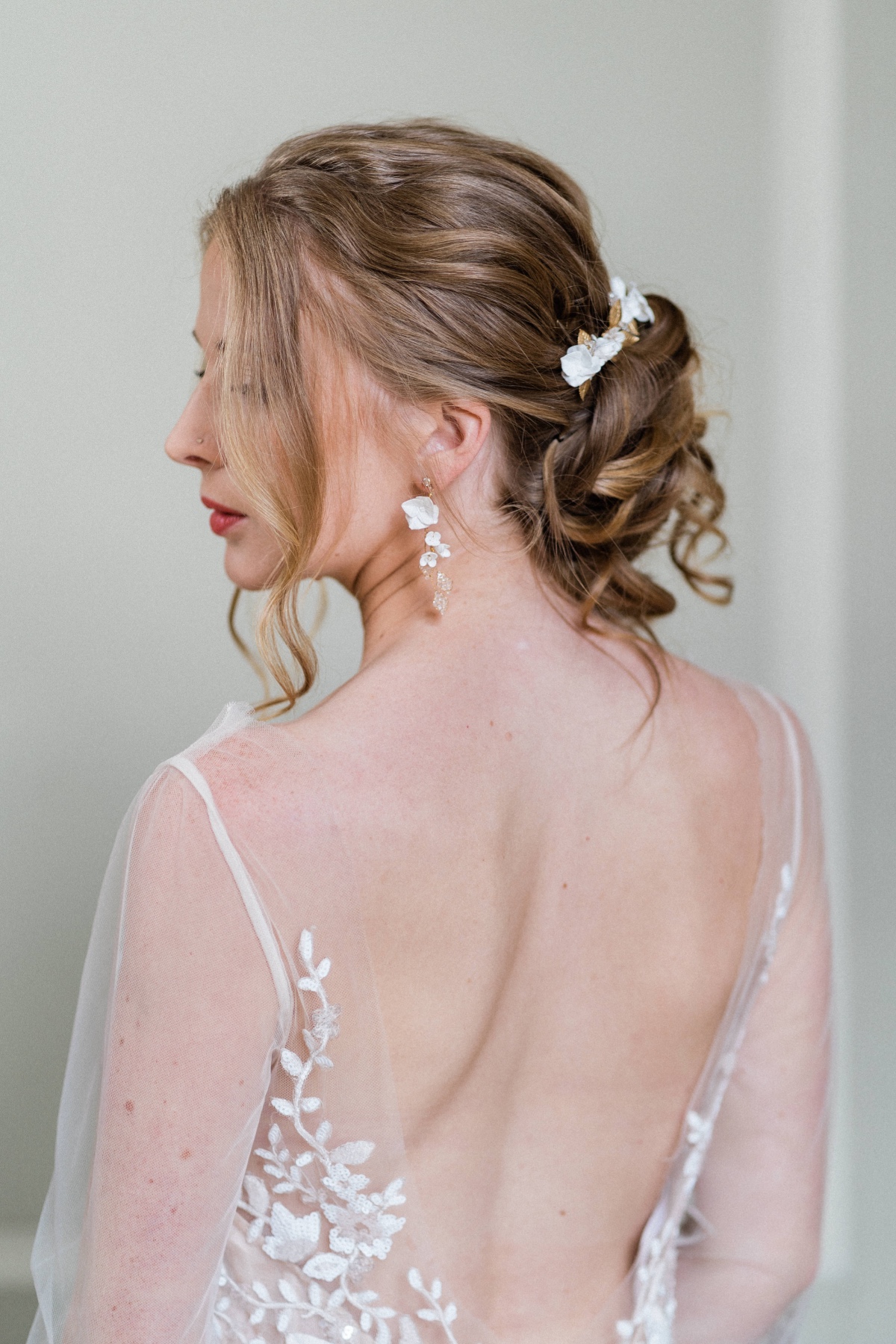 Bride with floral hair accessories and sheer dress