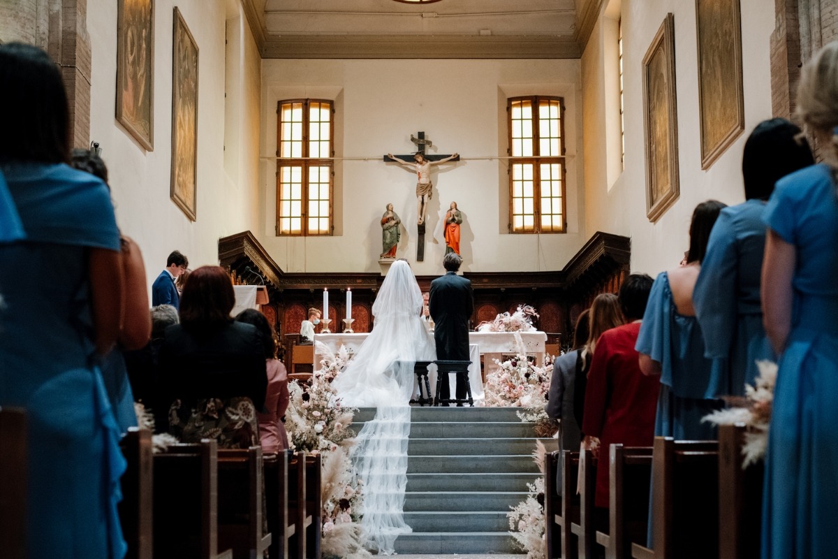 Bride and groom at altar in church wedding ceremony