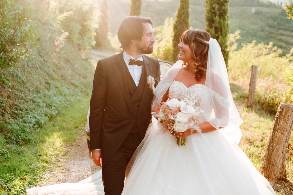 Bride and groom look lovingly at each other on wedding day