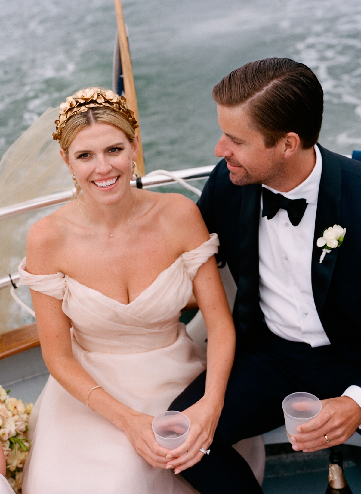 Bride ad groom on boat ride 