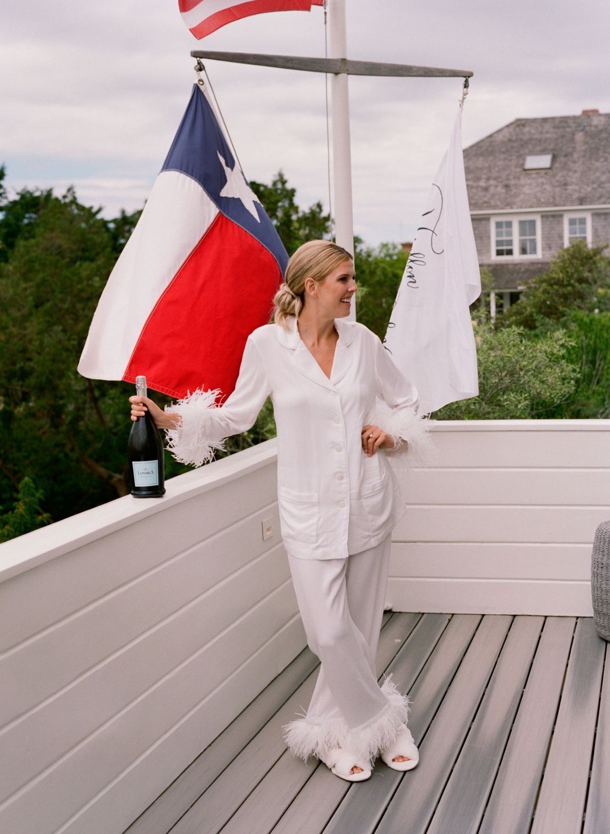 Elegant Nantucket bride in feathered pajamas 