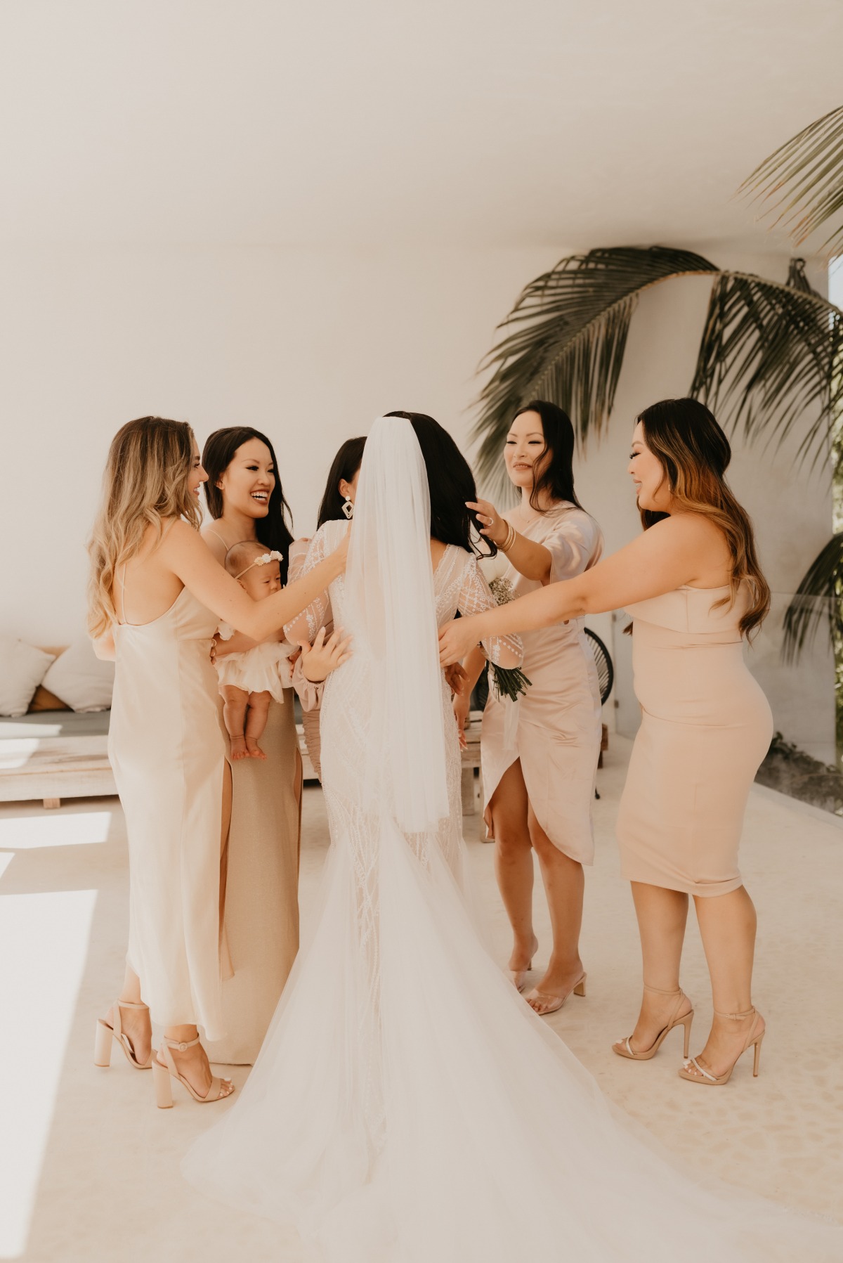 Emotional bridesmaids seeing bridal look